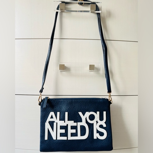 A navy blue shoulder and wristlet, adjustable strap to also wear as a crossbody - Picture 4 of 12